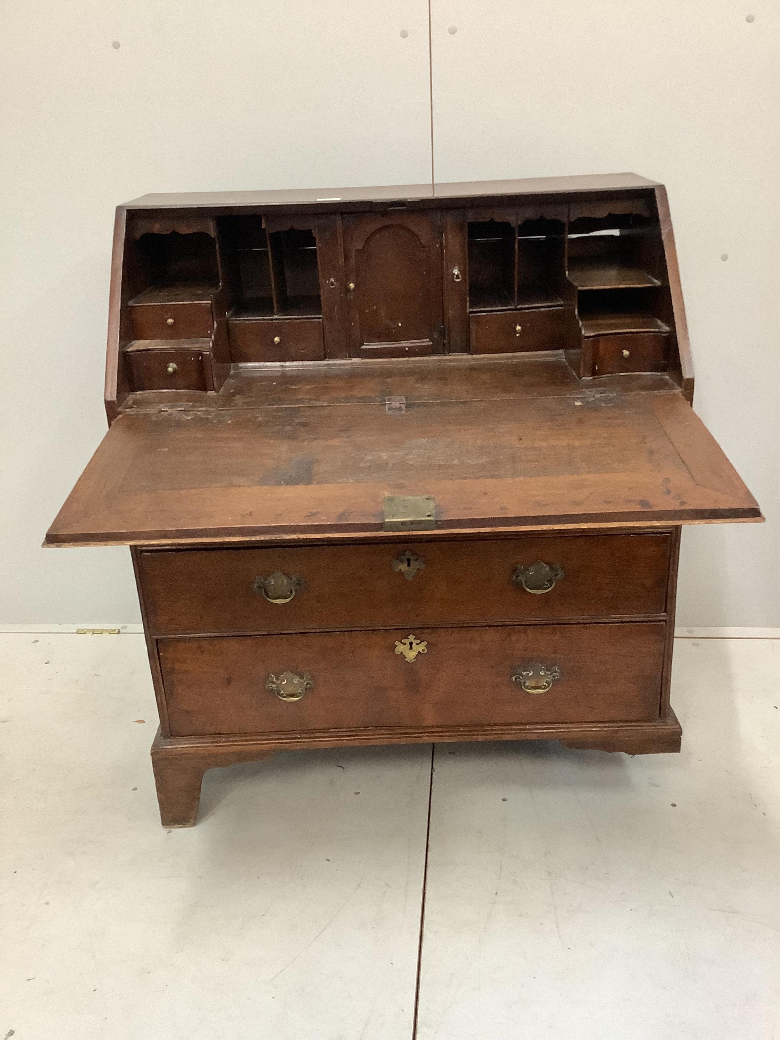 A George III oak bureau, width 91cm, depth 49cm, height 106cm. Condition - poor